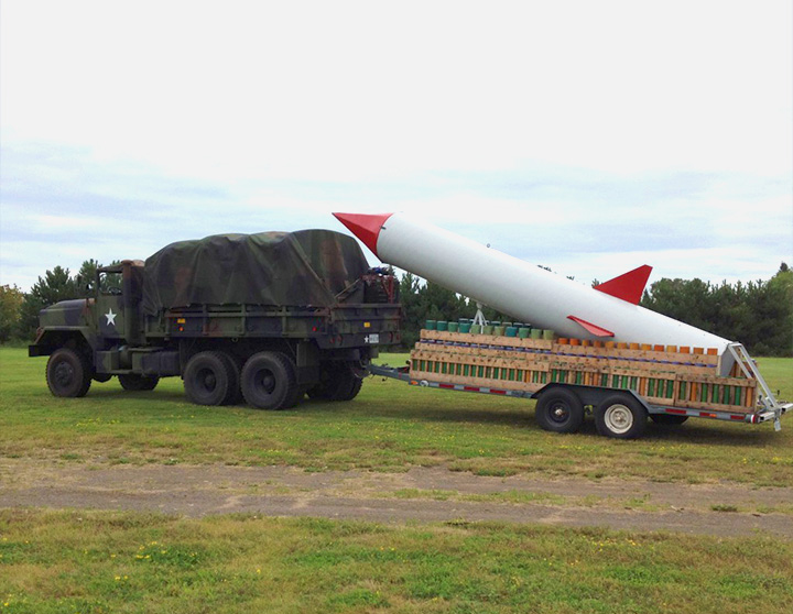 Army Truck delivering huge fireworks rocket
